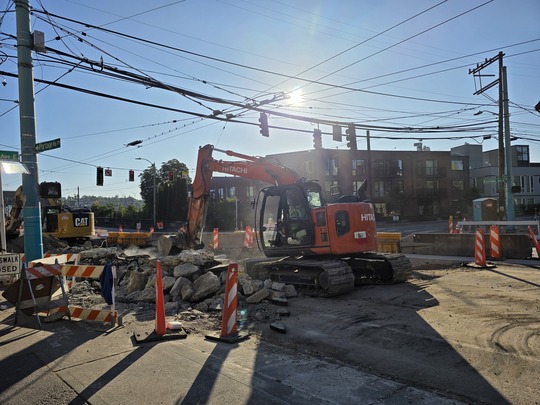 Crews move concrete debris on Eastlake Ave E and Fuhrman Ave E.