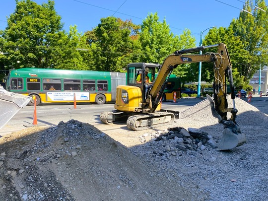 Crews move debris near E Galer St.