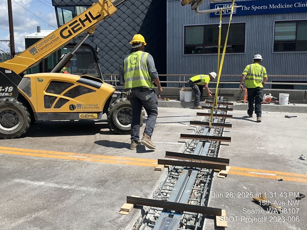Crews install new expansion joins on the Leary Way Bridge deck. Photo taken June 28, 2025.