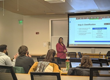 An OPA staff member giving a presentation about OPA to Seattle U college students
