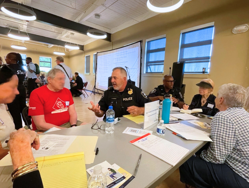 SPD Captain Davisson with Lt. Garth Haynes working with community members at the Seattle Public Safety Community Forum at Magnuson Community Center