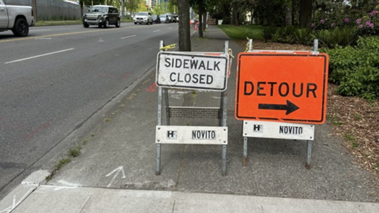 Sidewalk closed and sidewalk detour signs