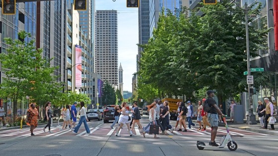 People crossing a street in Downtown Seattle