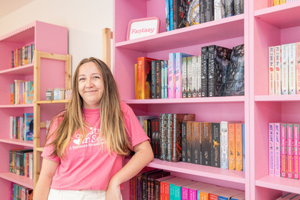 lovestruck in Seattle owner standing by a bookcase