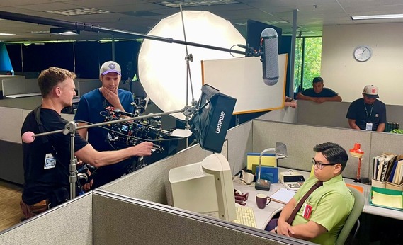 Behind the scenes of film crew filming commercial.