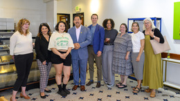 Mayor Harrell, business owner, and community members smiling at the Pan de la Selva celebration.