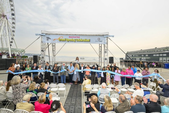 Mayor Bruce Harrell with other City employees and partners cutting a ribbon to celebrate the Waterfront Park grand opening