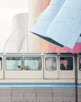The Monorail in motion as a dancer performs inside it