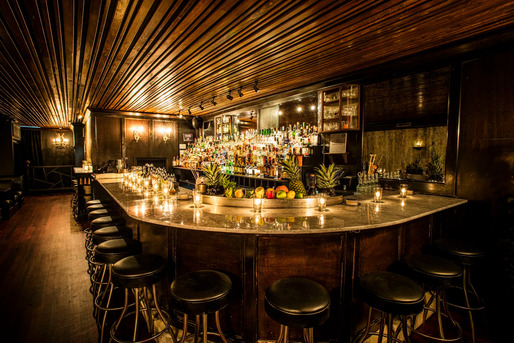 An empty cocktail bar with ambient lighting