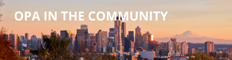 Seattle Skyline at sunset with the words OPA in the Community written in bold at the top in white font