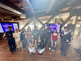 A group of 12 hackathon participants at the AI House in Seattle