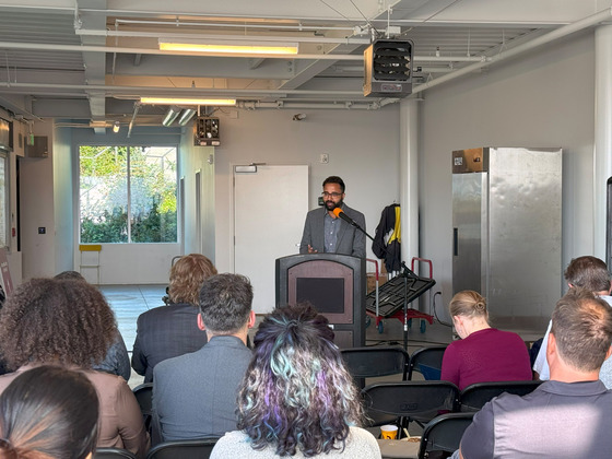 Capital Access and Finance Advisor Agraj Dangal speaking to lenders, small business owners, and other stakeholders