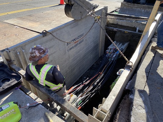Crews install new electrical lines under Fairview Ave N.