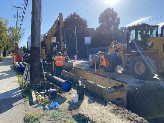 Crews build trenches for the new water main on Eastlake Ave E.