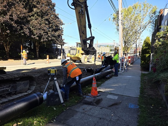 Crews prepare to install new water main pipes. 