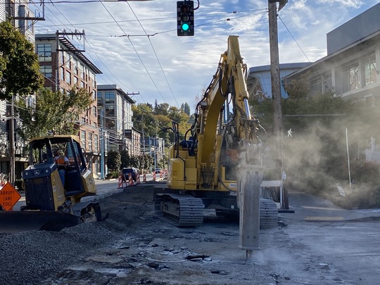 Crews demolish concrete on Eastlake Ave E between E Garfield St and E Galer St. 