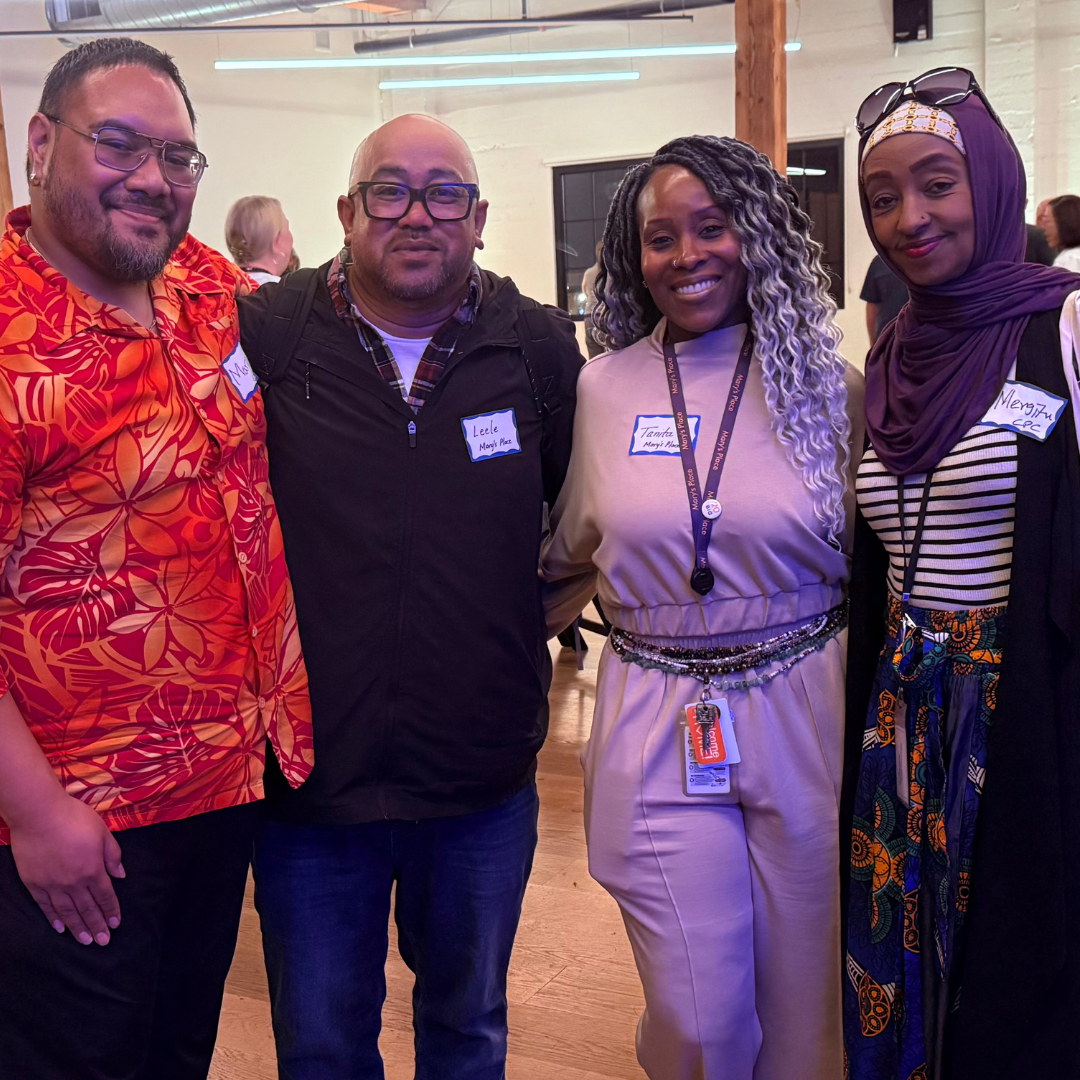 Mario and Mergitu with community members at the West Seattle Advisory Council