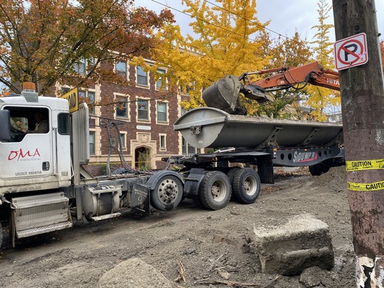 Crews remove concrete between E Boston St and E Howe St.