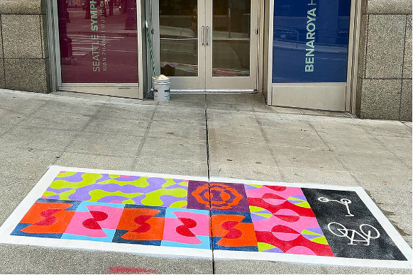 painted sidewalk space for scooters and bikes