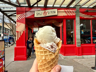 ice cream in a cone in front of new salt and straw location