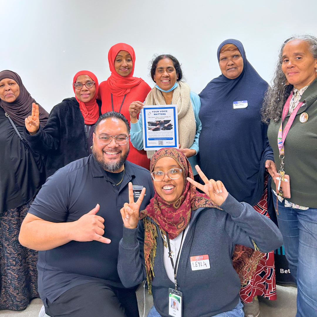 Mario & Mergitu posing with Community Builders from the Seattle Housing Authority