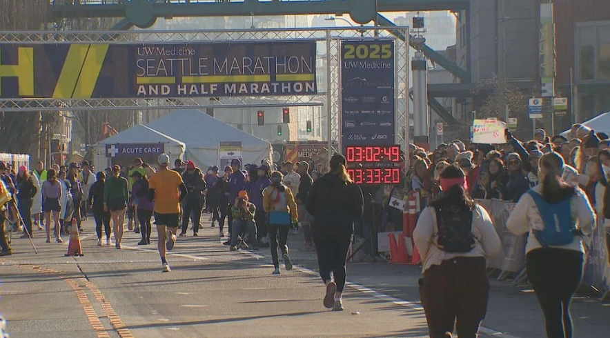 Runners crossing the finish line at pier 66