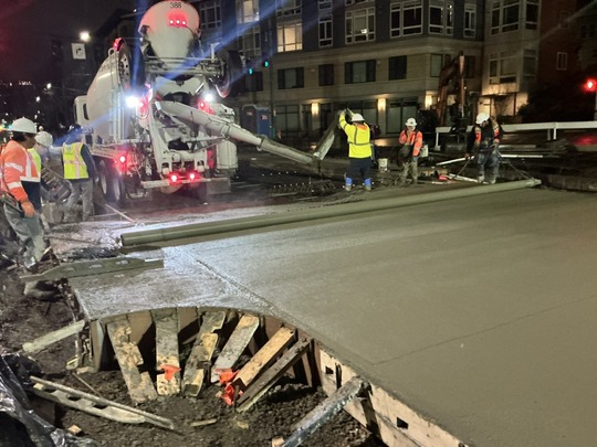 Crews pour new concrete on Eastlake Ave E.