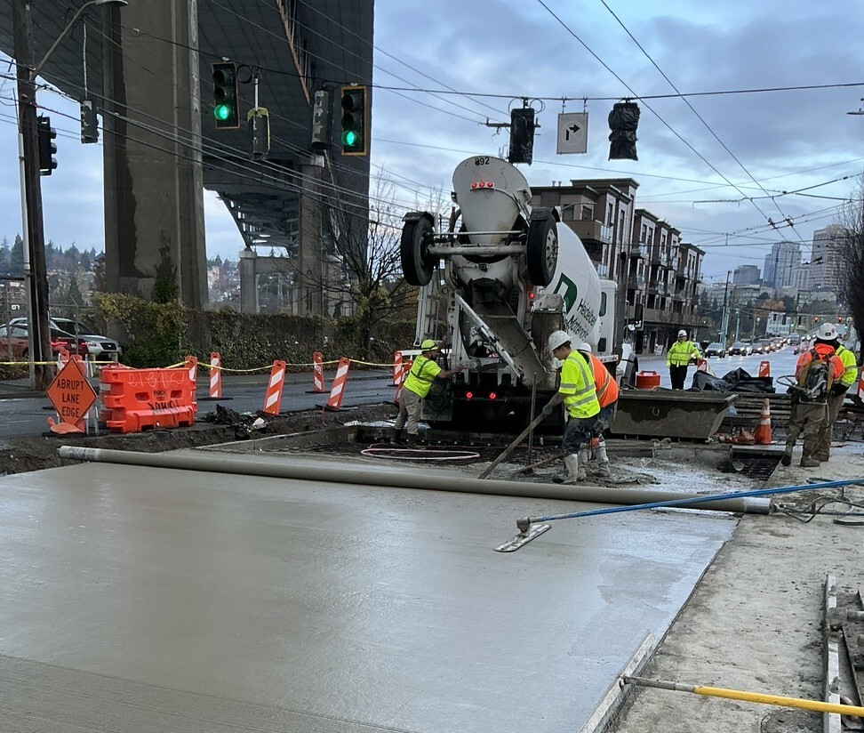 Crews smooth out new concrete near Harvard Ave E and Eastlake Ave E.