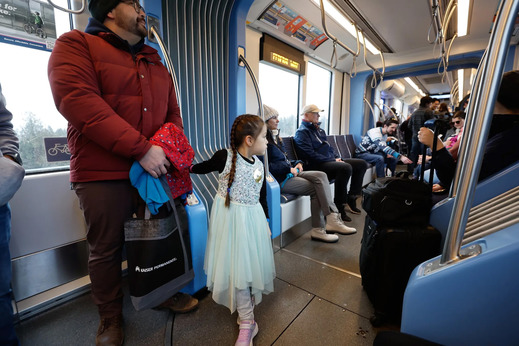 People riding the trains on opening day of Sound Transit’s light rail extension into South King County
