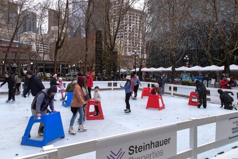 People ice skating at the Occidental Square pop up ice skating rink