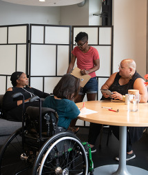 A group of people chatting at a table