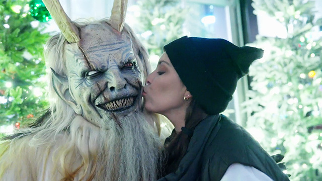 Krampus gets a kiss on the cheek