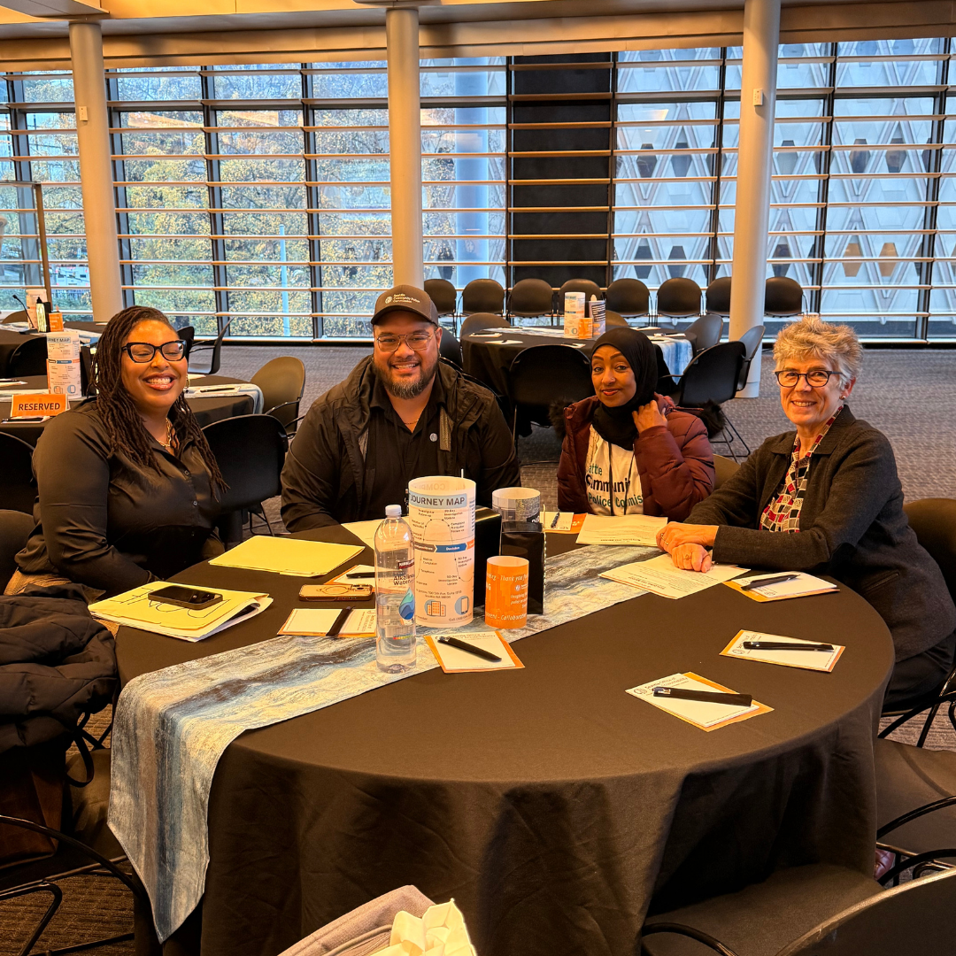 CPC staff at the table setting up the event