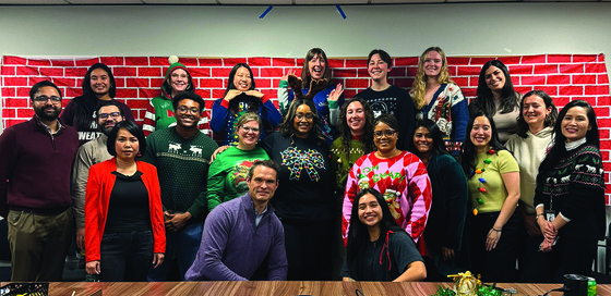 group photo of OED staff in a conference room