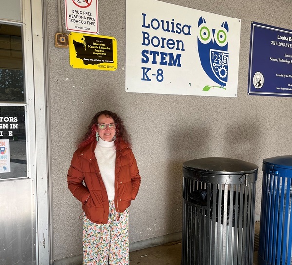 color photo of woman standing in front of Louise Boren STEM K-8 School
