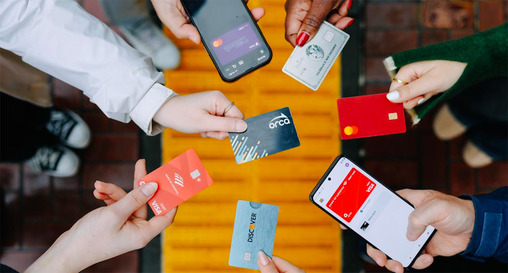 ORCA card surrounded by mobile wallets and other credit cards featuring a new "tap to pay" feature