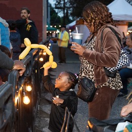 Child smiling at Columbia City Night Market