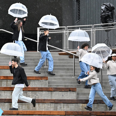 Performers dancing with umbrellas during Seafair's Winter by the Water festival
