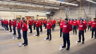 Recruit Class 124 standing at attention in the apparatus bay