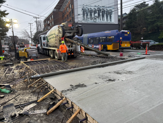 Crews pour new concrete near Aegis Living on Eastlake Ave E. 
