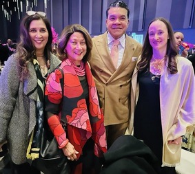 Bonnie Glenn, Regina Glenn, Brian Surratt and Mayor Katie Wilson in formal event wear standing in a ball room.