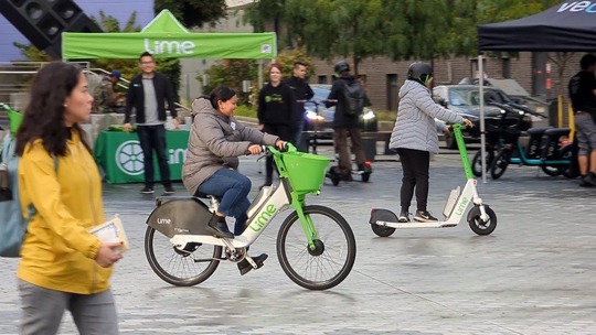 Community members test out Lime scooters and bikes
