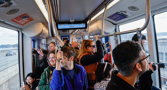 Passengers experiencing the new light rail across Lake Washington