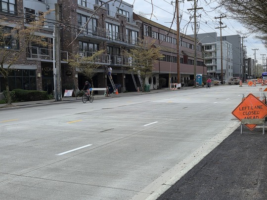 Cyclists travel along Eastlake Ave E each day on completed sections of smoother road surfaces.   