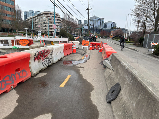 A path directs pedestrians and bicyclists around the construction on Fairview Ave N. 