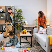 Family cleaning their living room