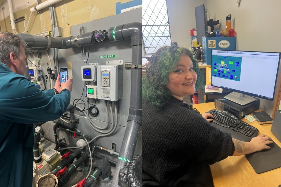A student uses his phone to take a picture of the HVAC system controls and a student uses a desktop computer to view HVAC equipment data. 