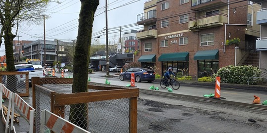 Cars and people on bikes are shifted to the east side of Eastlake Ave E as we complete paving on the west side. 