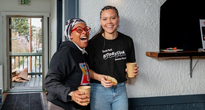 Two people smiling during the Best Day Ever event