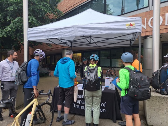 People riding bikes viewed the plans for the new protected bike lanes on Eastlake Ave E and Fairview Ave N.